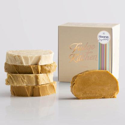 Fudge Kitchen Caramel and Cream Fudge Selection presented in a buff gift box and Congratulations decorative seal