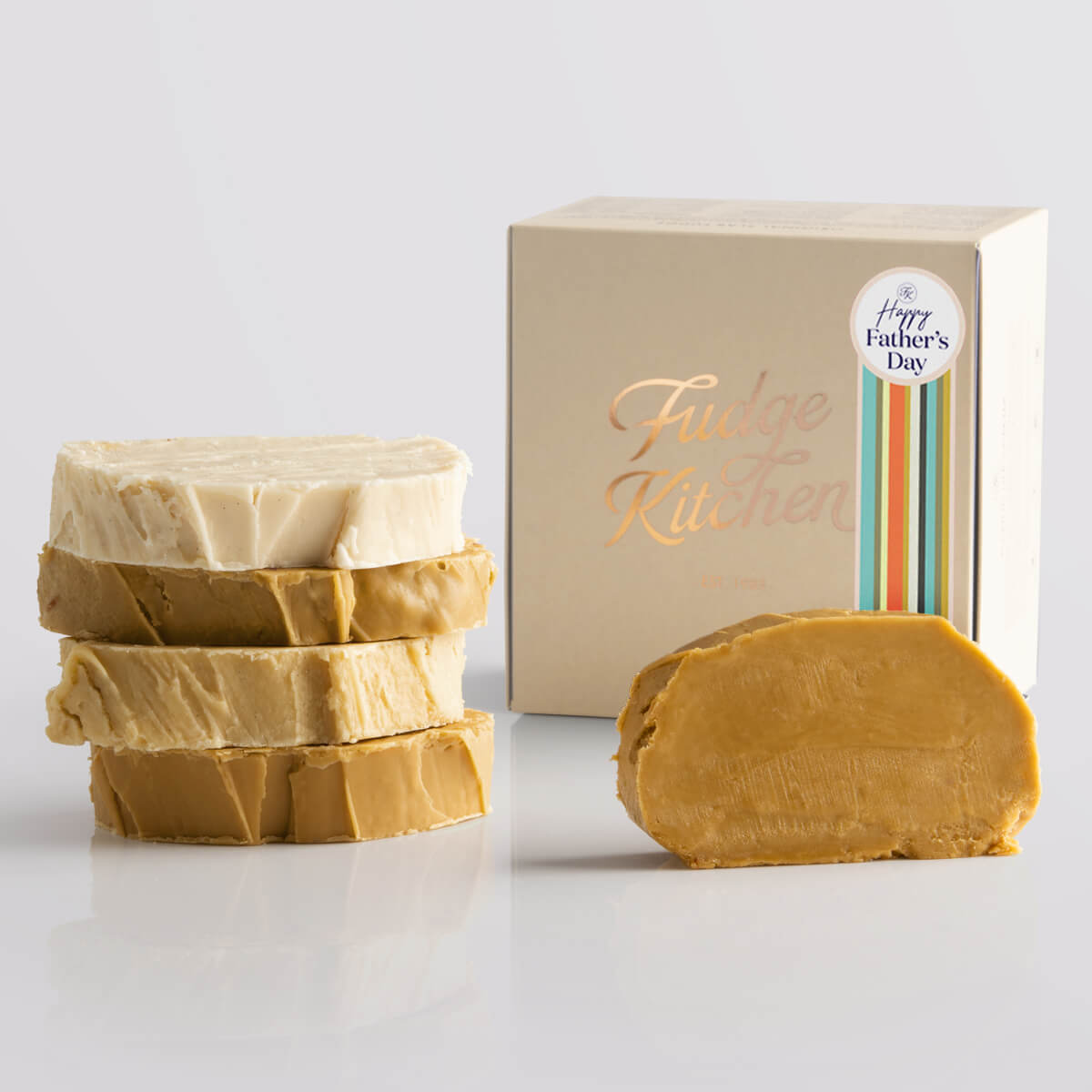 Fudge Kitchen Caramel and Cream Fudge Selection presented in a buff gift box and Happy Father's Day decorative seal