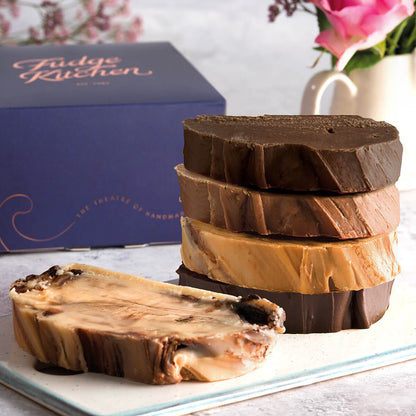 Cocoa Loco Fudge Selection showing fresh chocolate fudge on a plate with a guilded gift box