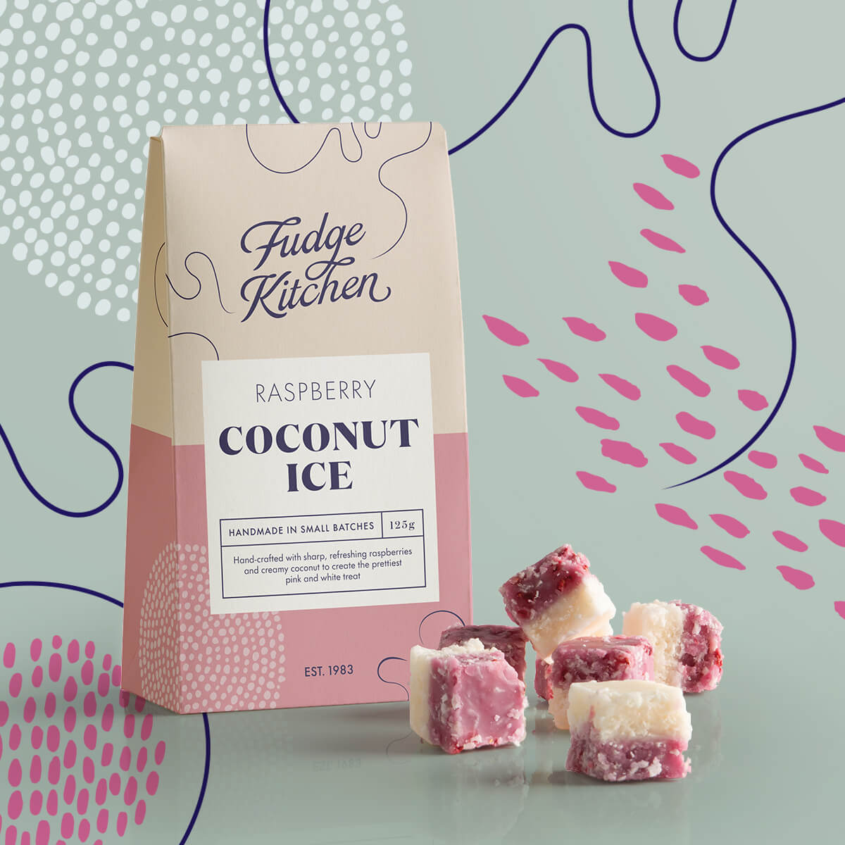 Close-up of the pink and white layers of Raspberry Coconut Ice, showcasing the blend of tangy raspberry and creamy coconut with decorative swirls in the background.