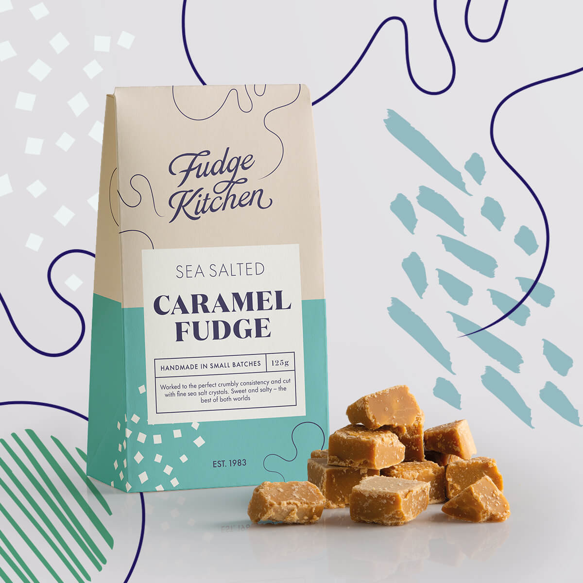 Sea Salted Caramel Fudge in its pack, with crumbly fudge squares displayed alongside with decorative swirls in the background.