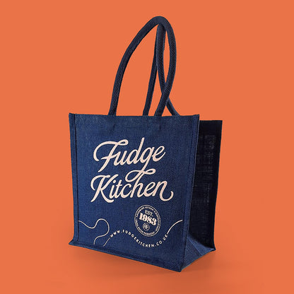 Fudge Kitchen Shopping Bag, highlighting the high-quality fabric and the bold Fudge Kitchen logo. A practical and stylish accessory for fudge lovers and eco-conscious shoppers.