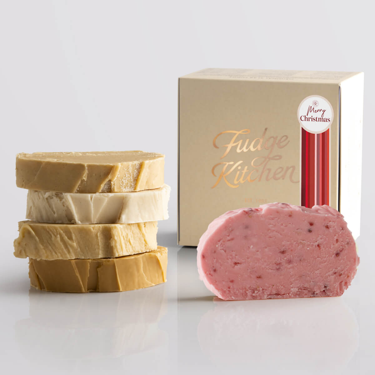 Toffee fudge and fruit fudge selection presented in a buff gift box and Merry Christmas decorative seal.