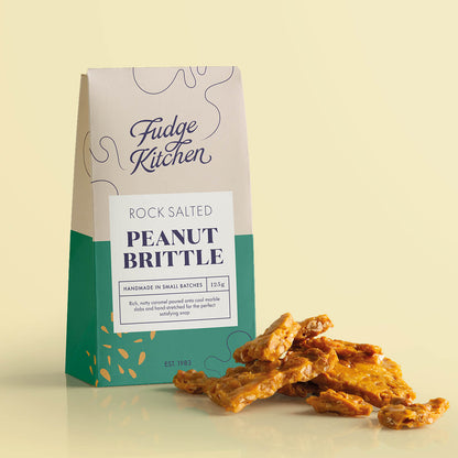 Rock Salted Peanut Brittle in its pack, with rich caramel brittle pieces displayed alongside.