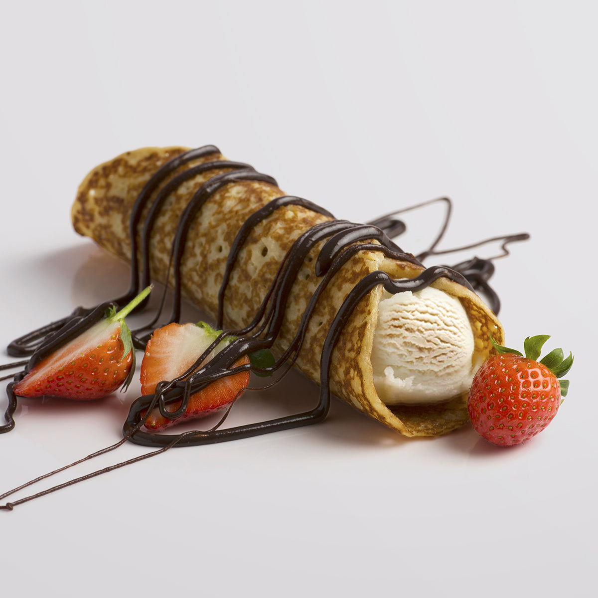 Indulge in the ultimate treat with our rich fudge sauce drizzled over fluffy pancakes. Perfect for adding a sweet, decadent touch to any breakfast or dessert. Explore our premium fudge collection at Fudge Kitchen