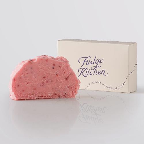 Raspberry Sorbet Fudge single slice, a Fudge Kitchen indulgent, handmade fudge flavour displayed with an elegant gift box.