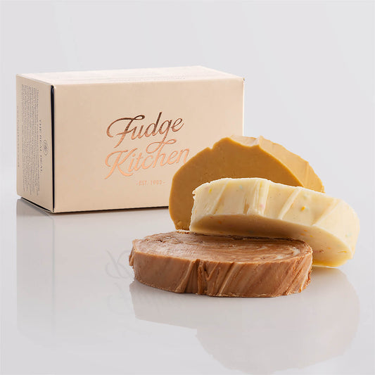 Birthday-themed fudge trio in an elegant buff-coloured gift box with gilded accents.