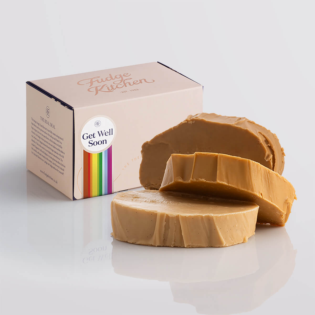 A stack of creamy caramel fudge in an elegant buff-coloured gift box with gilded accents and a get well soon box seal.