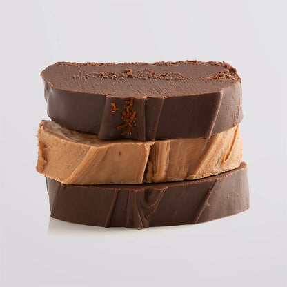 A stack of rich chocolate fudge slices showcasing their decadent texture.