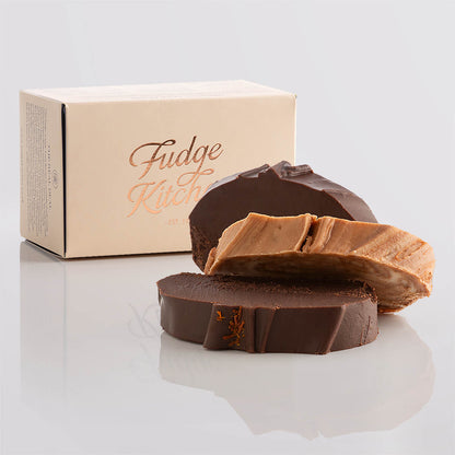 Chocolate fudge slices elegantly displayed in a buff-coloured gift box with gilded accents.