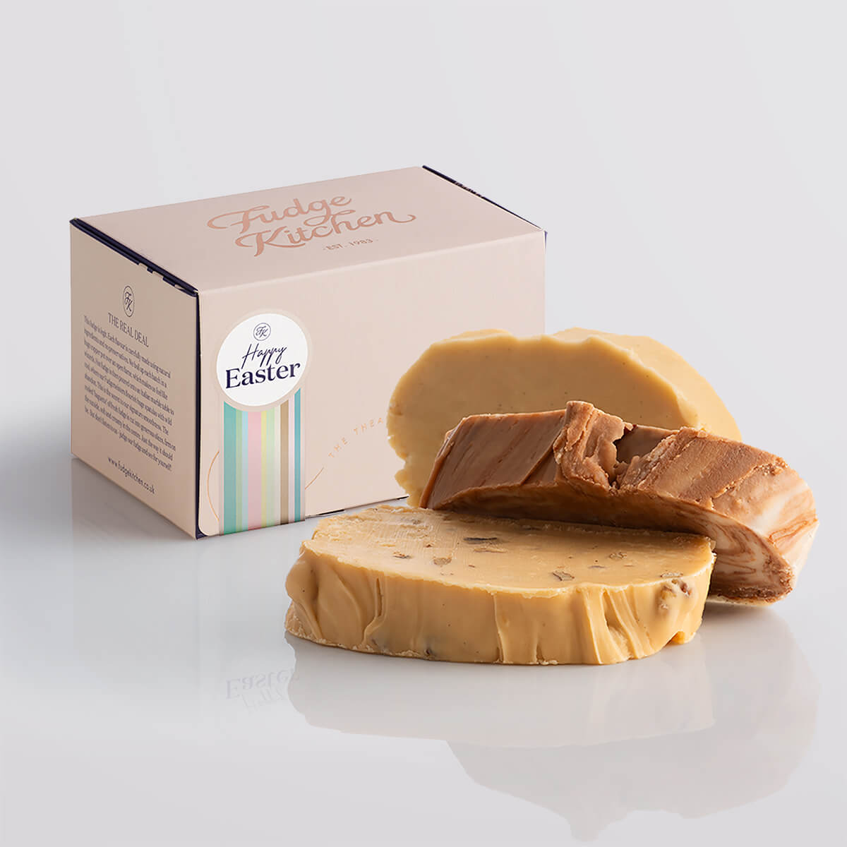 Classic fudge trio presented in an elegant buff-coloured gift box with gilded accents and a Happy Easter box seal.