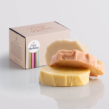 Fruity fudge trio elegantly packaged in a buff-coloured gift box with gilded accents and a 'Happy Birthday' box seal.