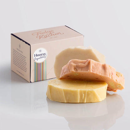 Fruity fudge trio elegantly packaged in a buff-coloured gift box with gilded accents and a 'Congratluations' box seal.