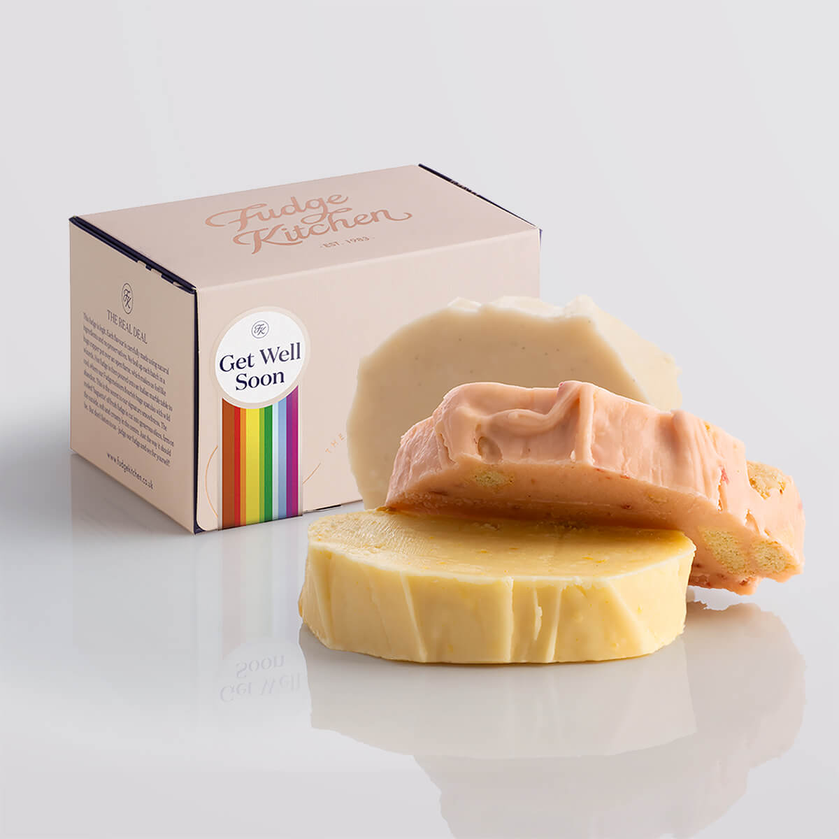 Fruity fudge trio elegantly packaged in a buff-coloured gift box with gilded accents and a 'Get Well Soon' box seal.