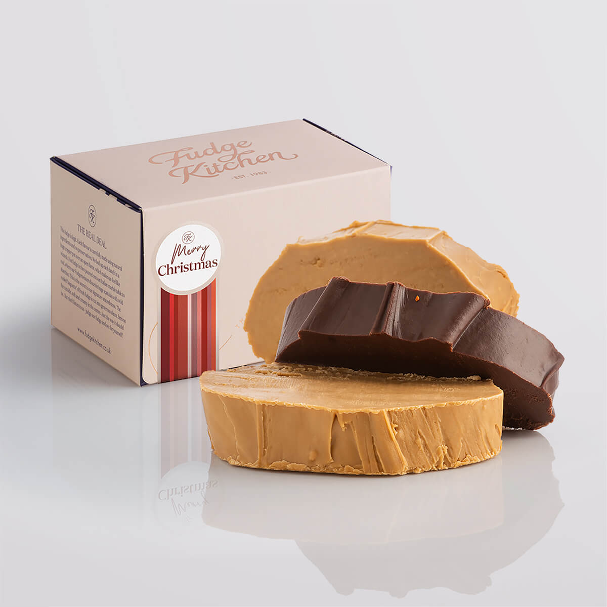 Vegan fudge trio elegantly displayed in a buff-coloured gift box with gilded accents with a 'Merry Christmas' box seal.