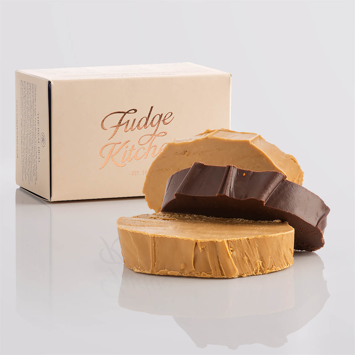 Vegan fudge trio elegantly displayed in a buff-coloured gift box with gilded accents.