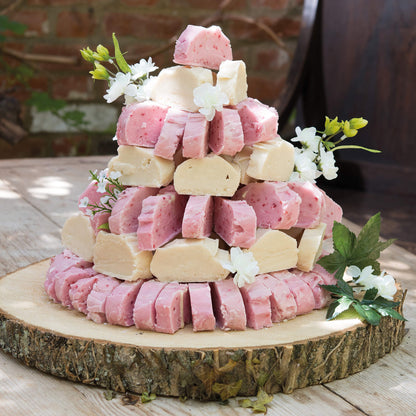 Fudge Sculptures by Fudge Kitchen displayed at a wedding or celebration, adding a creative and delicious touch to the event. A memorable and edible art piece for guests to enjoy.