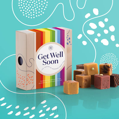 Fudge Kitchen Afternoon Tea Fudge Selection, elegantly presented in a box with nine delicious fudge pieces shown, with a Get Well Soon sleeve. Includes a variety of afternoon tea-inspired flavours, perfect for gifting or indulging.