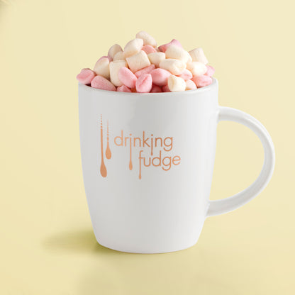 Drinking Fudge Mug by Fudge Kitchen, featuring a generously sized mug paired with fluffy marshmallows. Perfect for enjoying hot, creamy fudge drinks in the comfort of your home.