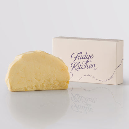 Sherbet Lemon Fudge single slice, a Fudge Kitchen indulgent, handmade fudge flavour displayed with an elegant gift box.