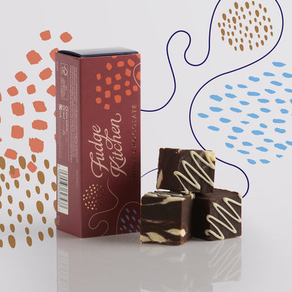 Elegant packaging of the Double Chocolate Fudge Trio Slider by Fudge Kitchen, beautifully presenting the swirls of creamy dark and white chocolate fudge. Ideal for gifting or as a premium dessert option.