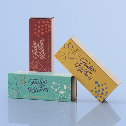 Elegant packaging of the Salted Caramel Fudge, Double Chocolate Fudge and Clotted Cream Fudge Trio Sliders from Fudge Kitchen, designed to beautifully present three rich, handmade fudge flavours.